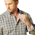 Man wearing a patterned shirt on a white background