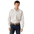 Man wearing a patterned white shirt and jeans on a white background