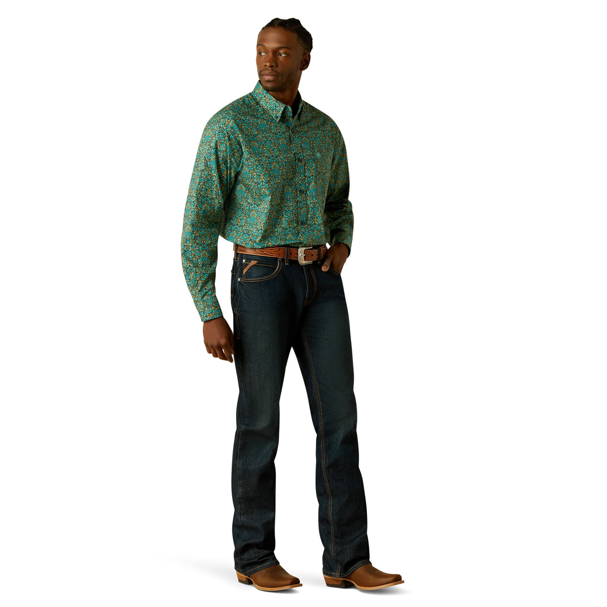 Man wearing a patterned shirt and jeans on a white background