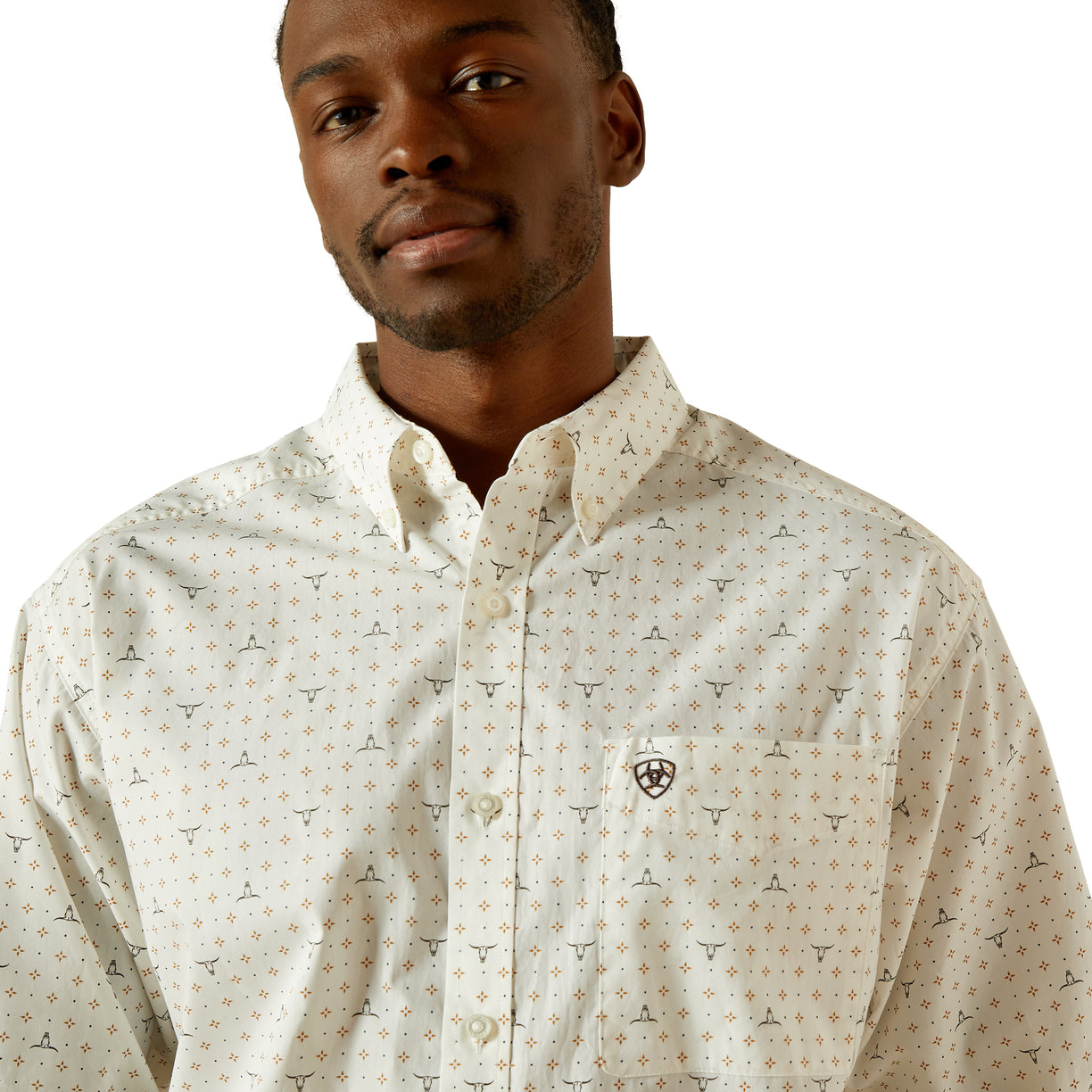 Man wearing a patterned shirt on a white background