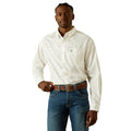 Man wearing a white patterned shirt and blue jeans on a white background