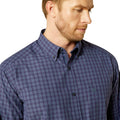Man wearing a blue checkered shirt on a white background