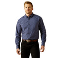 Man wearing a blue checkered shirt and black pants on a white background