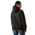 Person wearing a black hoodie from behind on a white background