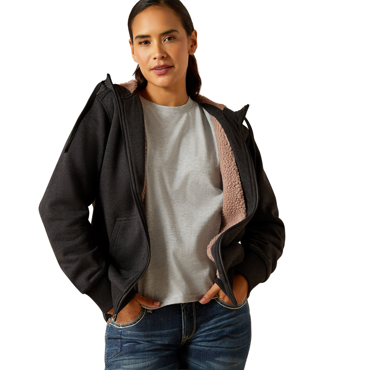 Woman wearing a black jacket with pink lining on a white background