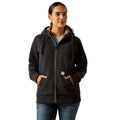 Woman wearing a dark gray hoodie on a white background