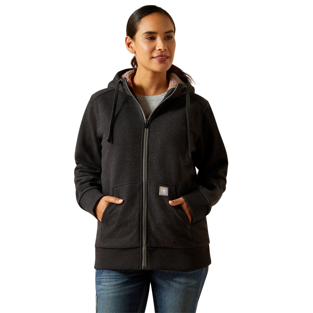Woman wearing a dark gray hoodie on a white background