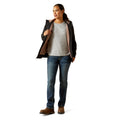 Woman wearing a jacket, shirt, jeans, and boots on a white background