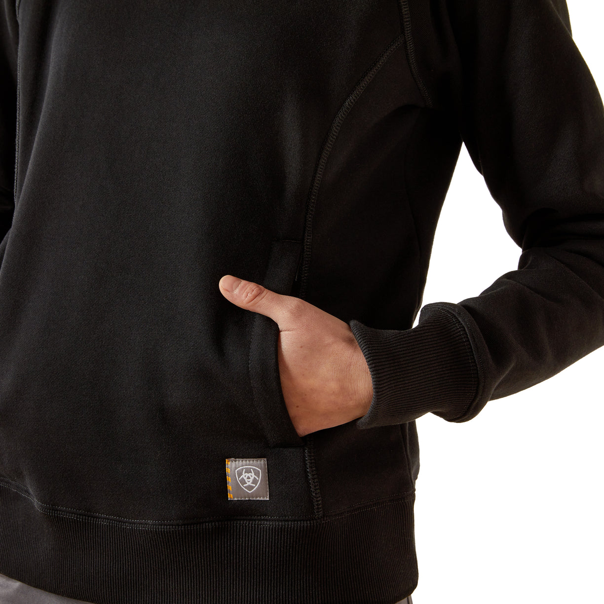 Black hoodie with a brand logo on the chest pocket against a white background