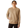 Woman wearing a beige sweatshirt on a white background