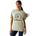 Woman wearing a light green Ariat t-shirt with a graphic design on a white background