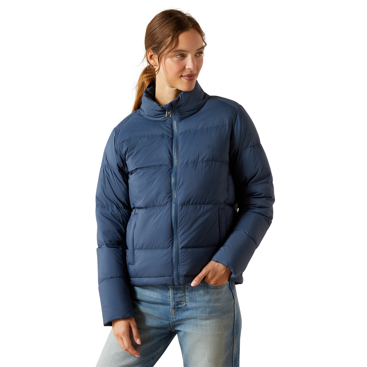 Woman wearing a blue puffer jacket on a white background