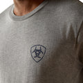 Gray t-shirt with a logo on the chest