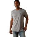 Man wearing a gray t-shirt with a logo on a white background