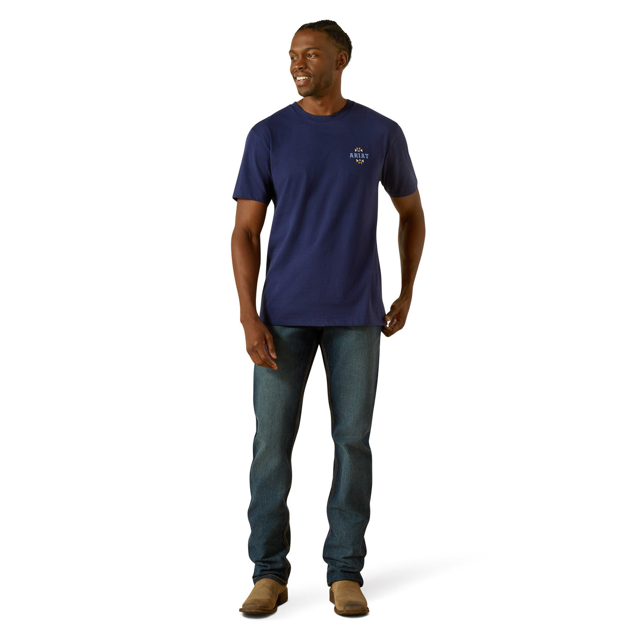 Man wearing a navy blue t-shirt and jeans on a white background
