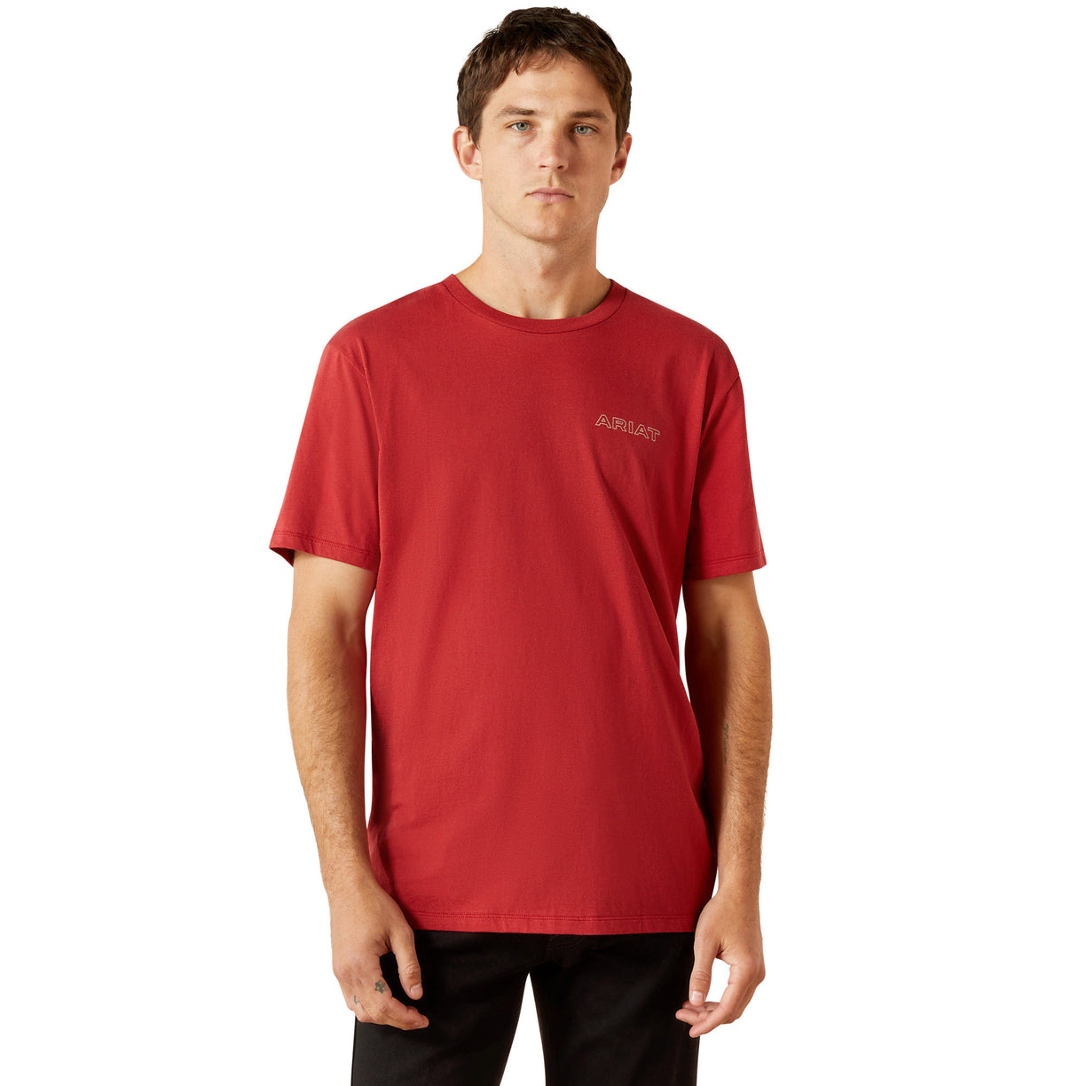 Man wearing a red t-shirt with a logo on a white background