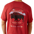 Red t-shirt with Ariat logo and bison graphic on a white background