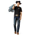 Man wearing a black t-shirt, blue jeans, and a cowboy hat holding a jacket on a white background
