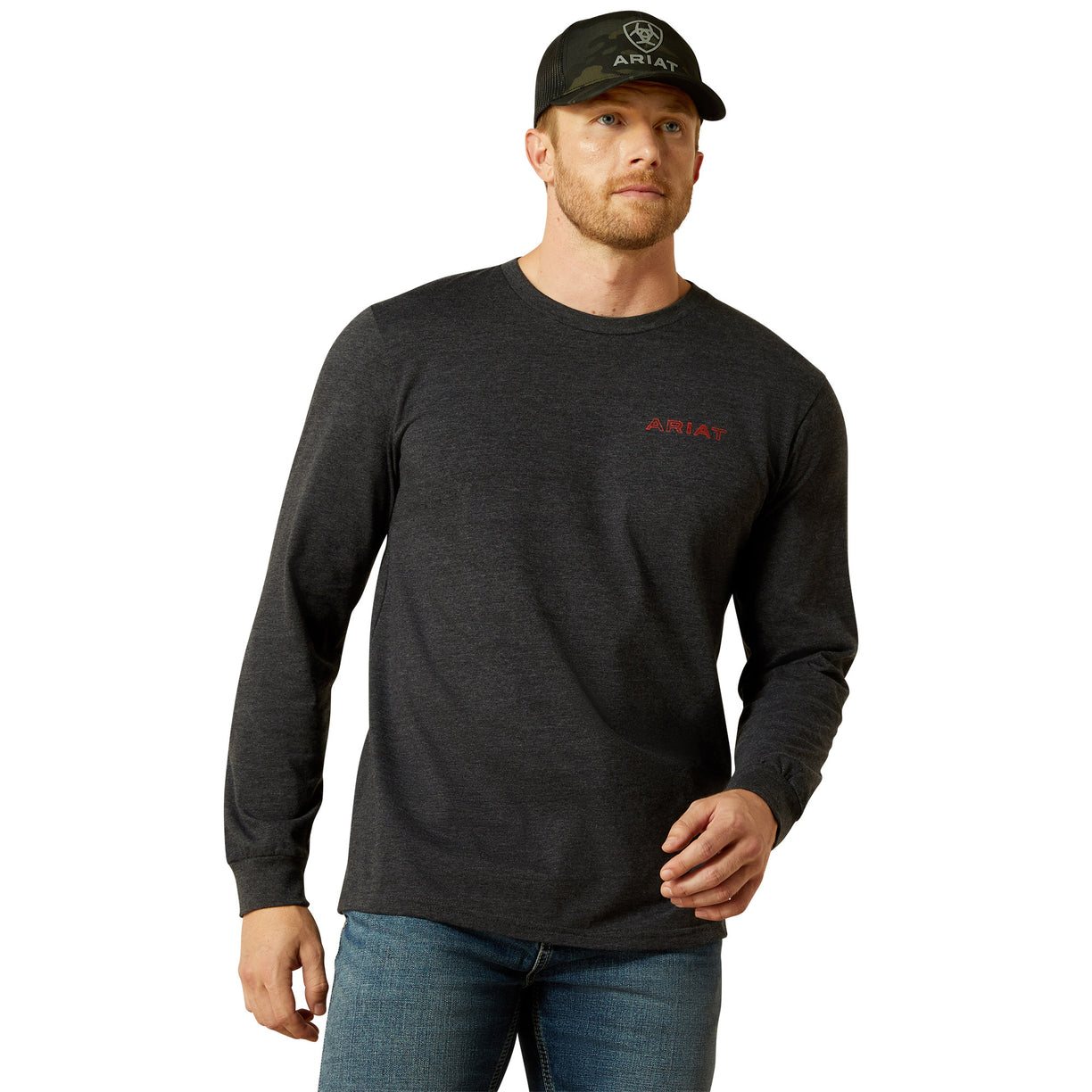 Man wearing a black long-sleeve shirt with Ariat logo and a black cap on a white background