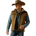 Man wearing a brown vest, blue shirt, and cowboy hat on a white background