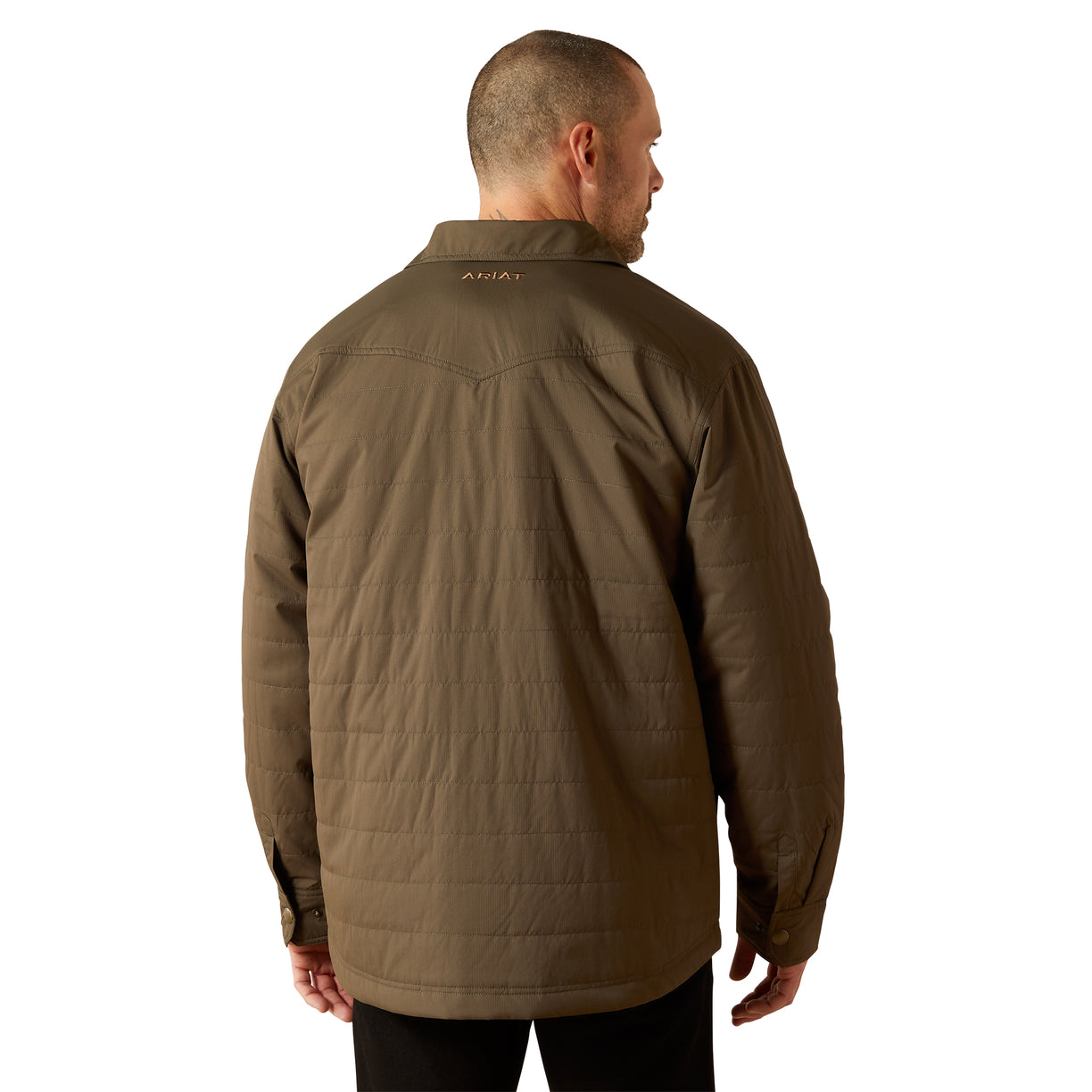 Man wearing a brown jacket with a brand logo on the back against a white background