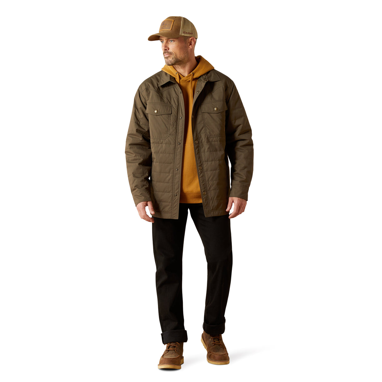 Man wearing a brown jacket, yellow shirt, black pants, and brown cap on a white background
