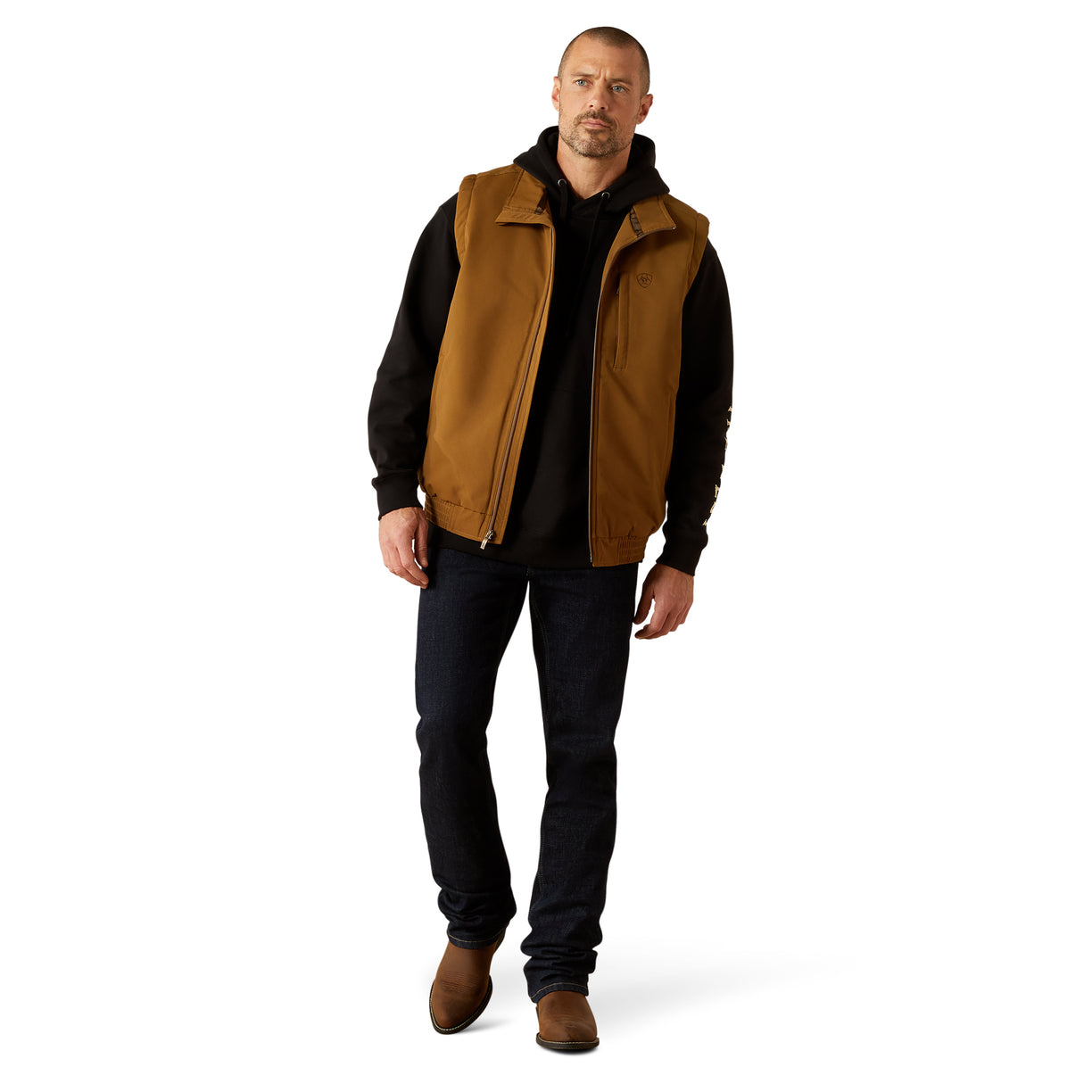 Man wearing a brown vest over a black shirt on a white background
