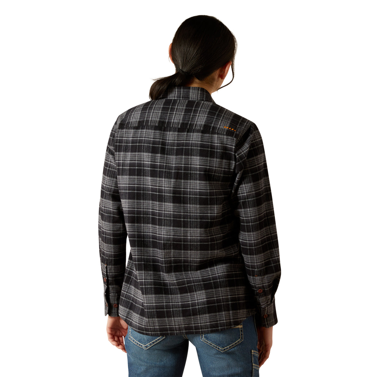 Person wearing a black and gray plaid shirt on a white background