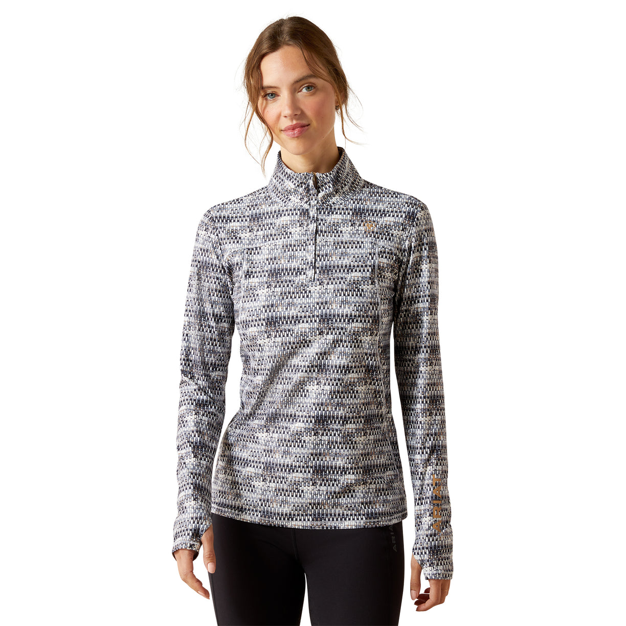 Woman wearing a patterned long-sleeve shirt on a white background