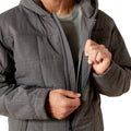 Person wearing a gray jacket with a hood on a white background