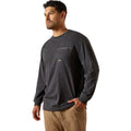 Man wearing a dark gray long-sleeve shirt with a pocket on a white background