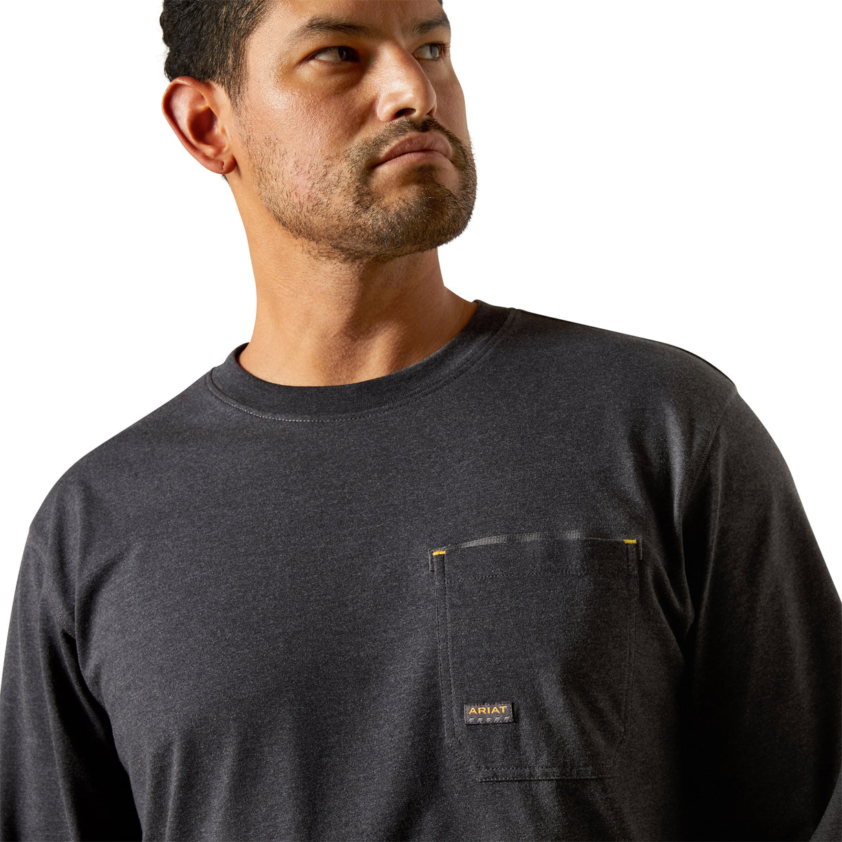 Man wearing a black long-sleeve shirt with a brand logo on a white background