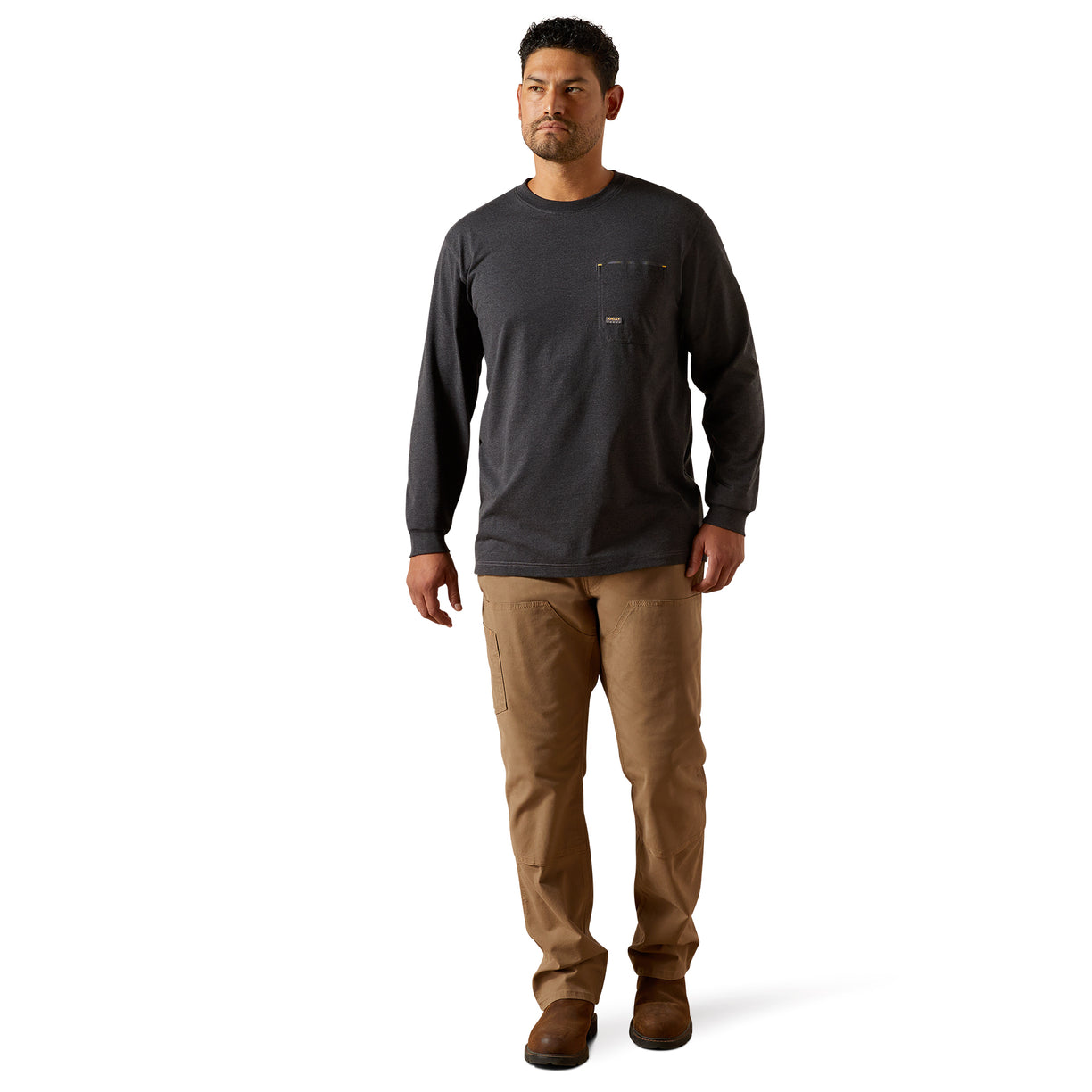 Man wearing a dark long-sleeve shirt and brown pants on a white background