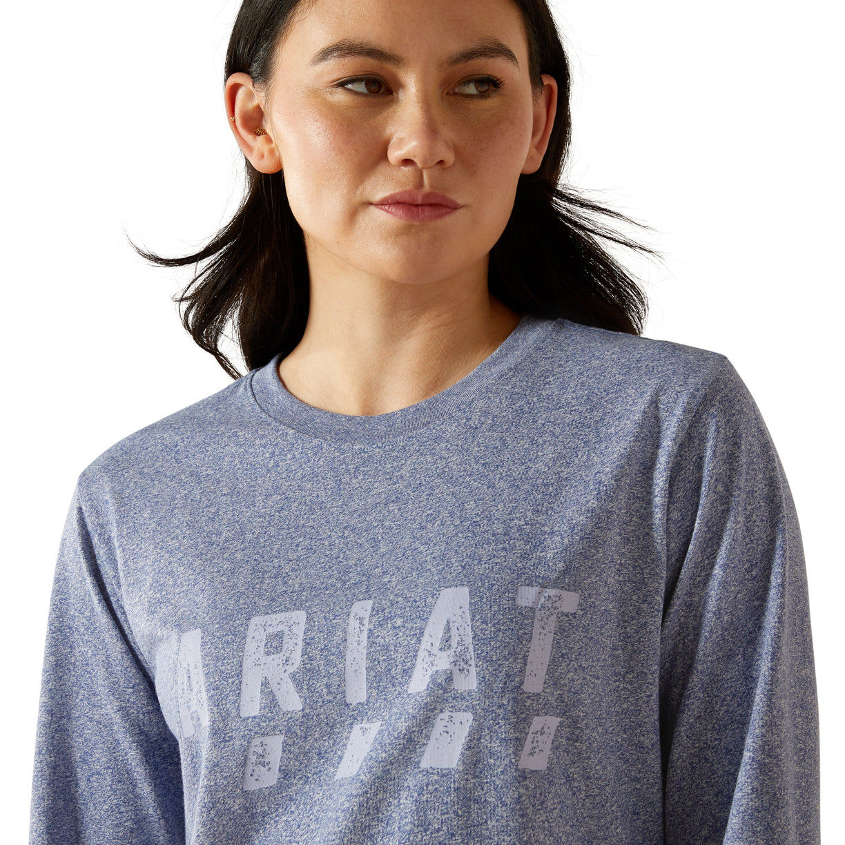 Woman wearing a blue long-sleeve shirt with a brand logo on a white background