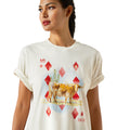 Woman wearing a white t-shirt with a graphic design of a bull and red diamonds on a white background