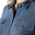 Close-up of a blue shirt with buttons and a pocket on a white background