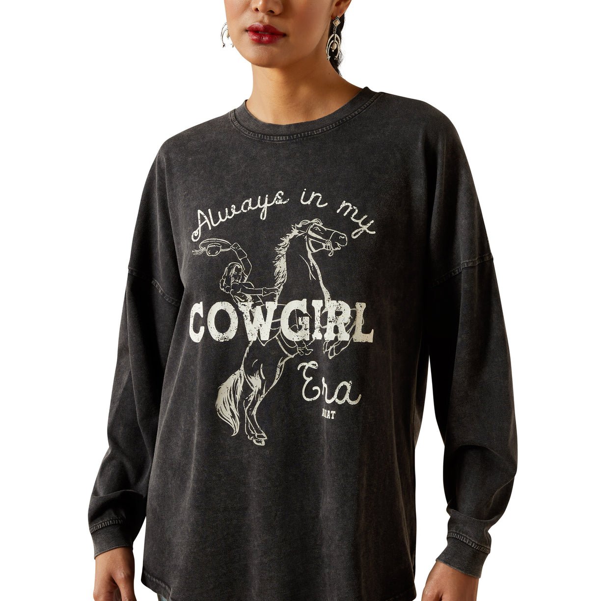Black long-sleeve shirt with horse graphic and text worn by a person on a white background