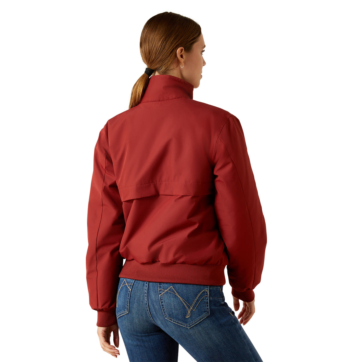 Person wearing a red jacket and blue jeans on a white background