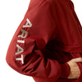 Red jacket with 'Ariat' branding on a white background
