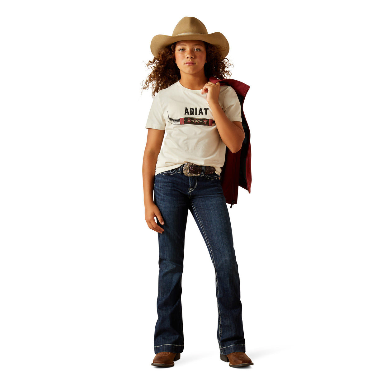 Person wearing a white t-shirt with 'Ariat' logo, blue jeans, and a cowboy hat on a white background