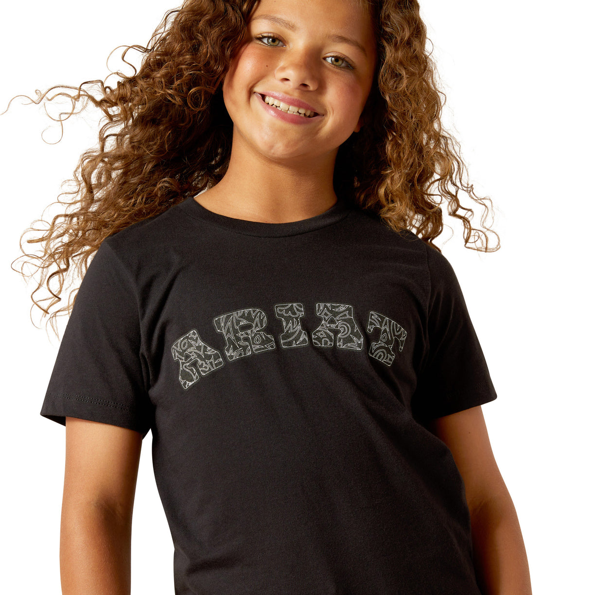 Child wearing a black t-shirt with white text on a white background