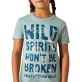 Child wearing a light blue t-shirt with 'Wild Spirits Won't Be Broken' text and Ariat logo.