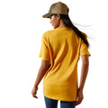 Person wearing a yellow t-shirt and beige cap on a white background