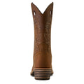 Brown cowboy boot with intricate stitching on a white background