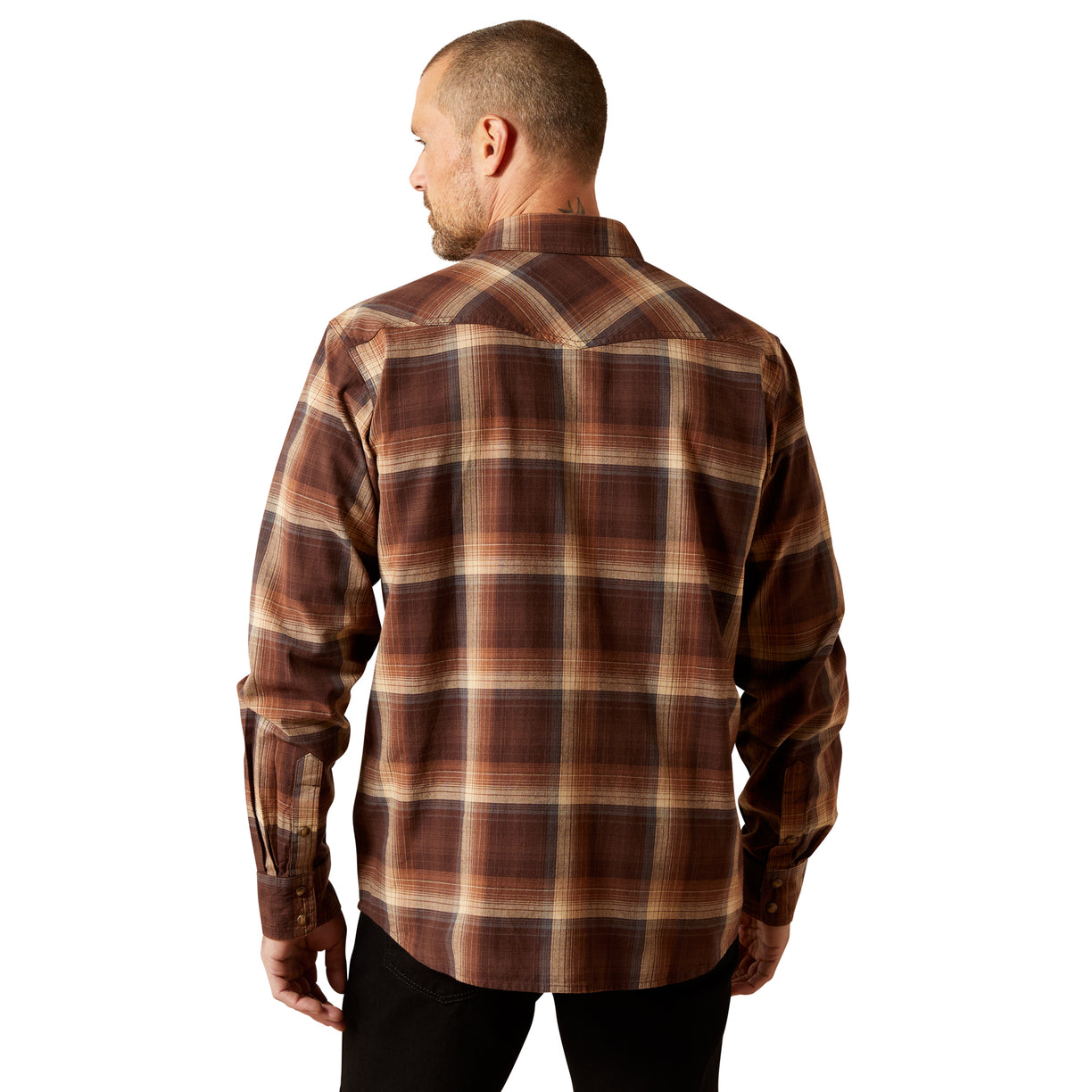 Man wearing a brown plaid shirt on a white background