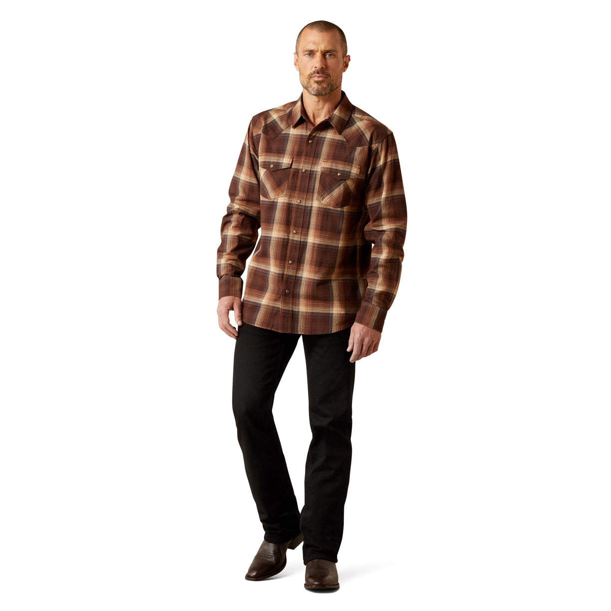 Man wearing a brown plaid shirt and black pants on a white background