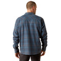 Man wearing a blue plaid shirt on a white background