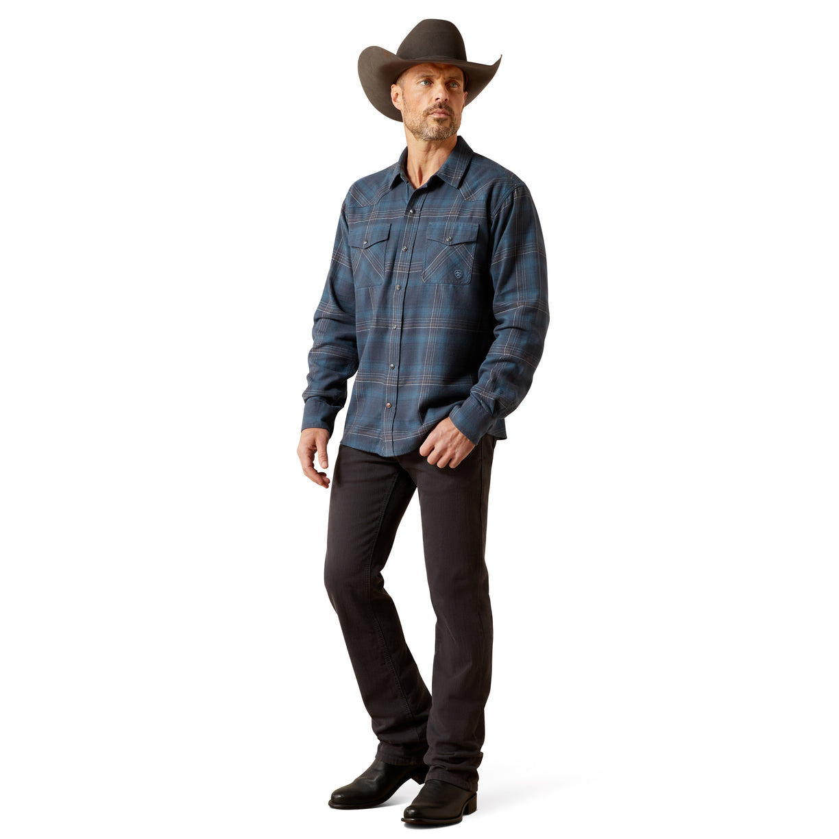 Man wearing a blue plaid shirt, black pants, and a cowboy hat on a white background