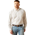 Man wearing a patterned shirt and jeans on a white background