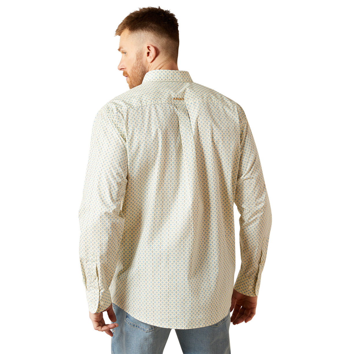 Man wearing a patterned shirt on a white background